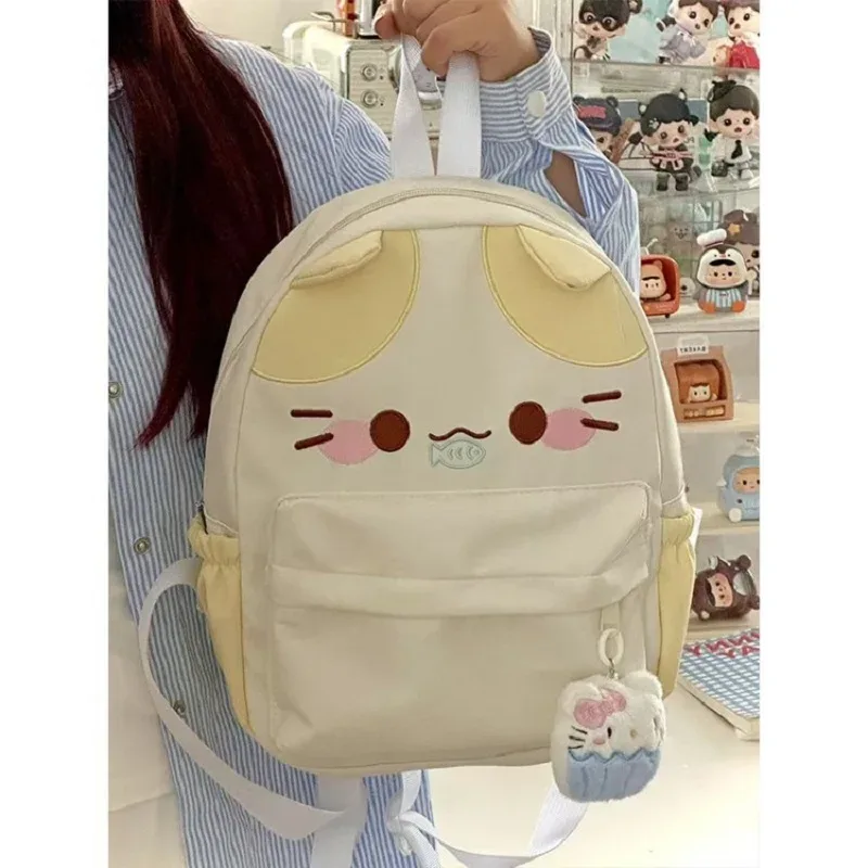 sac à dos imperméable en nylon pour femme avec motif chat dessinant une fille mangeant du poisson, sac d'école pour filles avec détails brodés, sac à livres