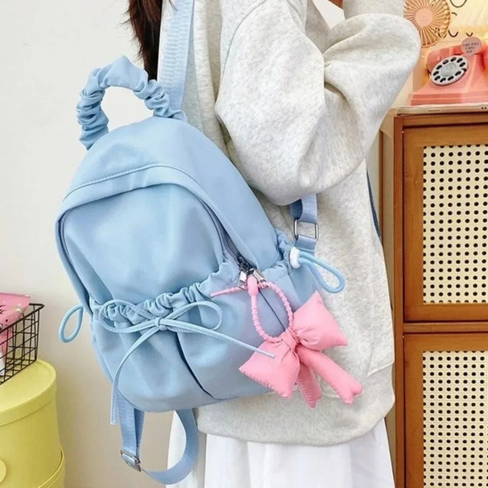 sac à dos en nylon pour étudiants, grande capacité, design plissé, sac de voyage, bretelles réglables, sac à dos souple avec nœud.