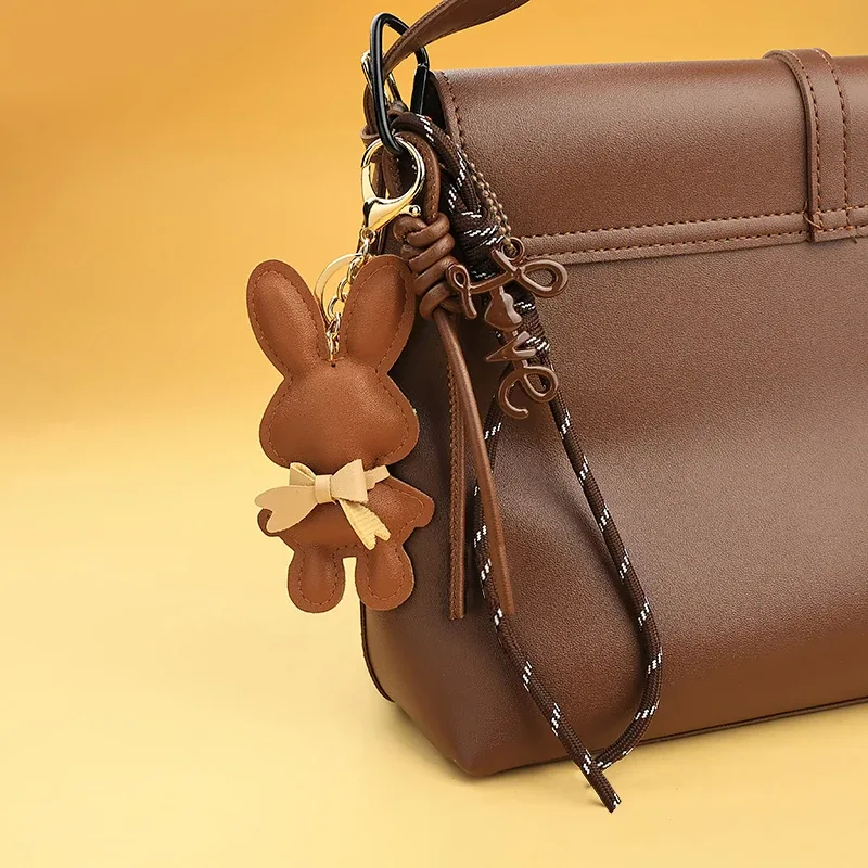 adorable porte-clés en cuir pu en forme de lapin avec petit nœud, pendentif animal mignon pour sacs à main et sacs à dos.