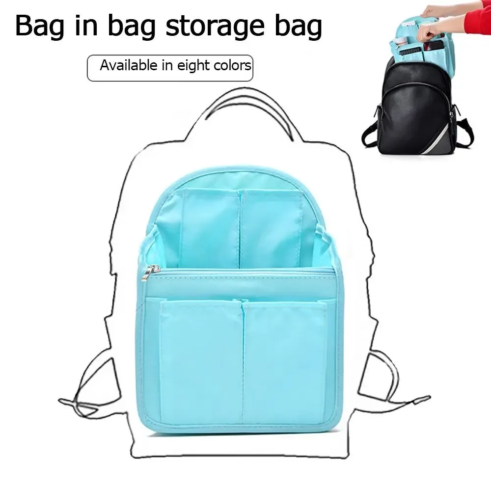 sac dos tissu oxford organisateur compartiments zips noir bandes blanches format rectangulaire poignée amovible usage voyage