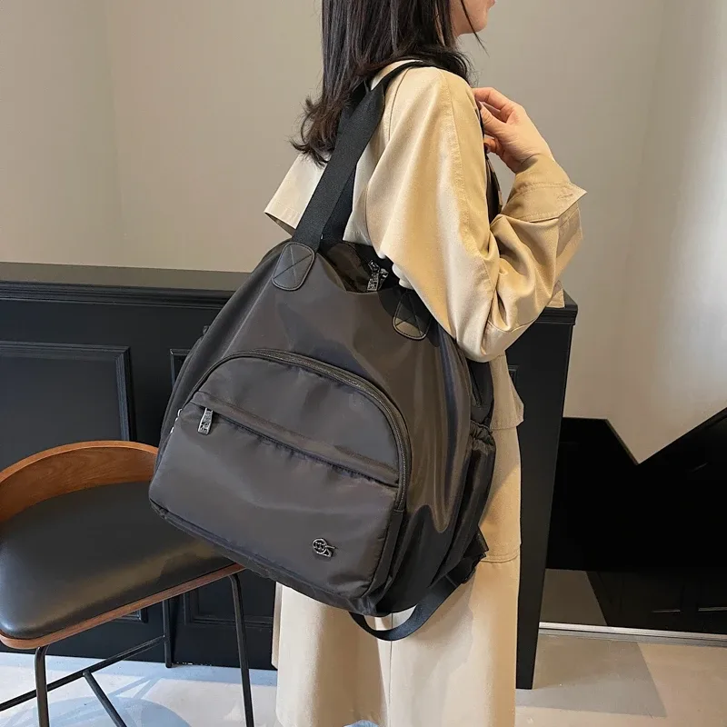 sac à dos de voyage en nylon pour femmes, sac à bandoulière multifonctionnel, style jeune et dynamique, sac d'école pour femmes