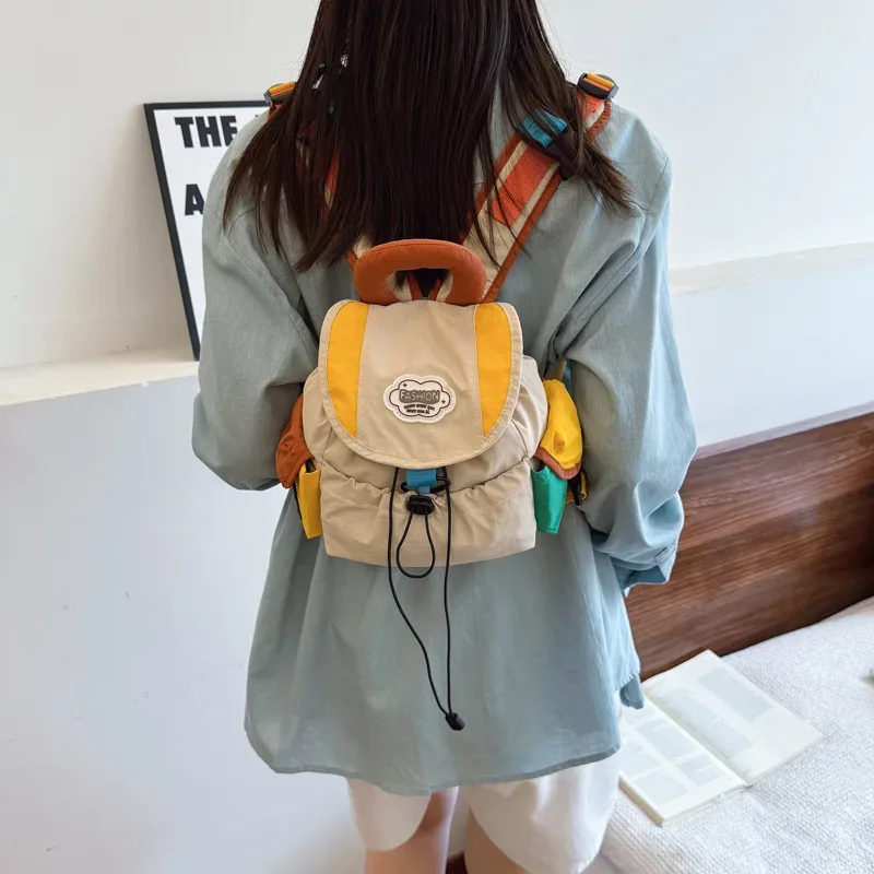 sac dos oxford cloth toile patchwork alphabet décontracté pompon bandoulière arquée anti-vol respirant usage idation voyager école pleinair
