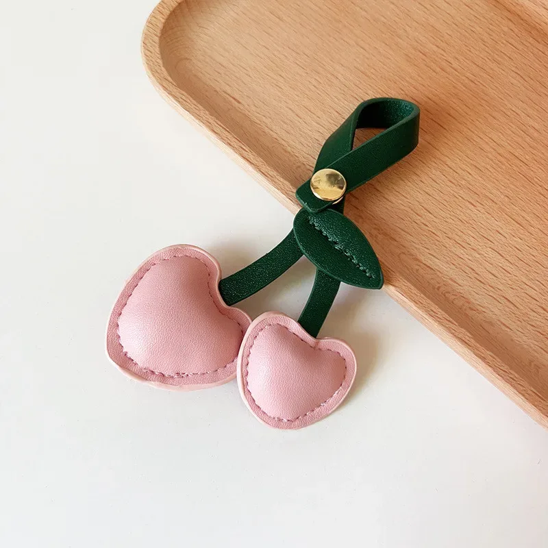 xmessun nouveau porte-clés pendentif cœur cerise rose pour sac à dos femme, breloque en cuir véritable tendance