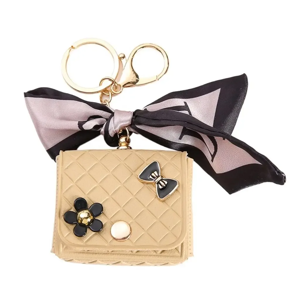 nouvelle pochette de rangement en cuir 2026 pour écouteurs, mini porte-clés créatif, pendentif couleur unie, étui pour écouteurs bluetooth