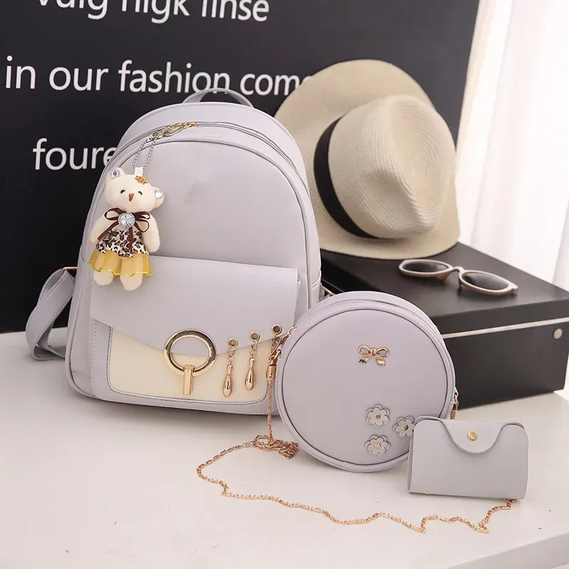 sac dos cuir synthétique gris motif géométrique relief bandoulière amovible porte-monnaie inclus voyage femme