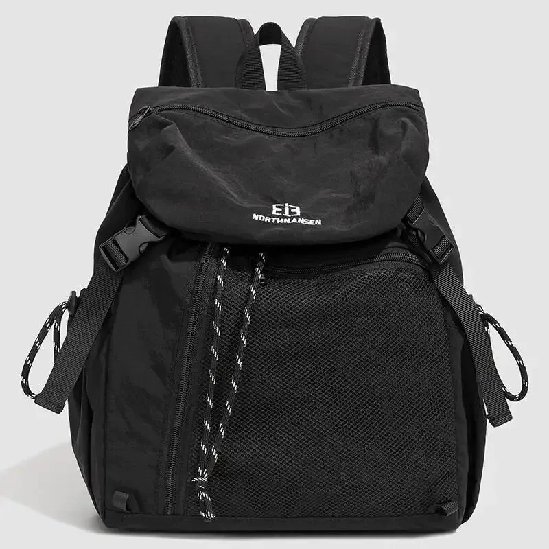 sac dos nylon noir poche zip latérale maille grise bretelles bandes logo blanc style voyage capacité litres