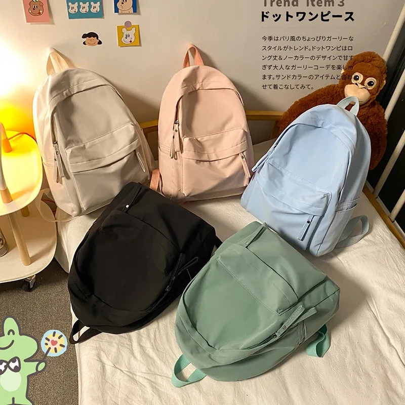 sac à dos simple de couleur unie pour femmes 2022 sacs d'école en nylon imperméable pour adolescentes sac à dos de voyage pour dames sac à bandoulière