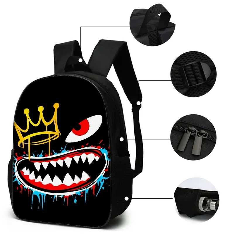 sac dos nylon beige dessin animé visage effrayant couronne dorée oeil rouge bouche ouverte dent pointue bandoulière arquée fermeture éclair grande capacité usage quotidien