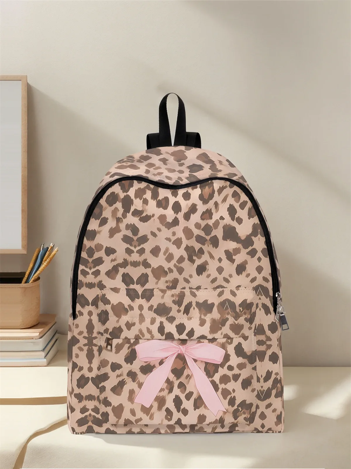 sac à dos à motif léopard et nœud, nouveau modèle 2025, sac à dos de voyage décontracté, léger et simple.