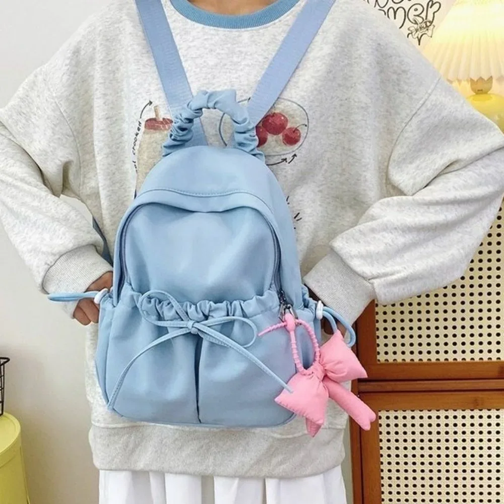 sac à dos en nylon pour étudiants, grande capacité, design plissé, sac de voyage, bretelles réglables, sac à dos souple avec nœud.