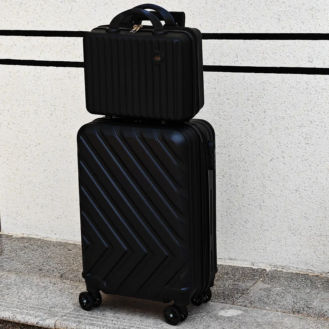 valise abs noir diagonale grand format toupie poignees surdimensionnee voyage familial transport affaires capacité elevee rangement couches roues universelles telescopic