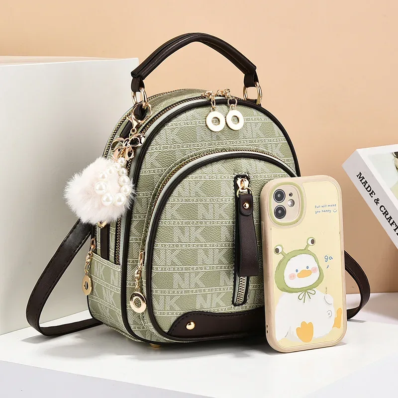 sac dos cuir similicuir vert motif géométrique pomponne métallique bandoulière amovible compartiment intérieur fermeture éclair polyvalent voyage