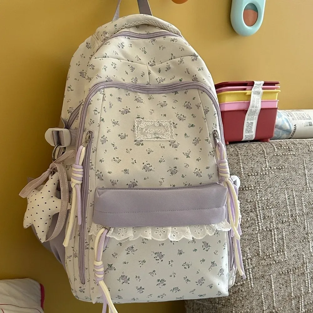 sac à dos à imprimé floral avec décor en dentelle, ultra léger, avec pendentif étoile, esthétique fraîche, grande capacité, idéal pour les trajets quotidiens.