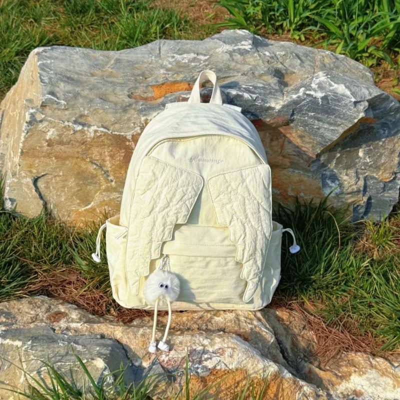 sac à dos ailes d'ange de marque pour filles, niche douce et polyvalente, en toile, nouveau sac de voyage tendance y2k avec pompon, grande capacité