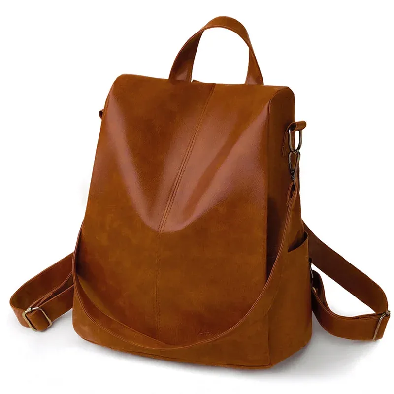 sac dos cuir matériau similaire marron clair texture grunge forme trapézoïdale poignées latérales sangle ajustable voyage femme