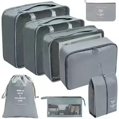 organisateur voyage polyester beige clair sac rangement vêtements chaussures sous-vêtements pochettes transparentes cubes modularité transport