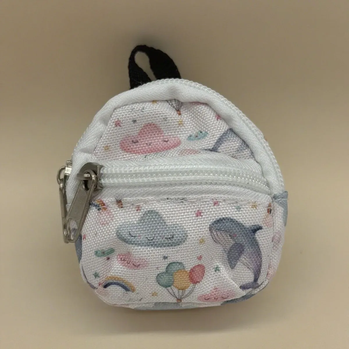 sac dos nylon petit format ovale fermeture glissière poche latérale double épaule poches latérales couleur vivante usage voyage