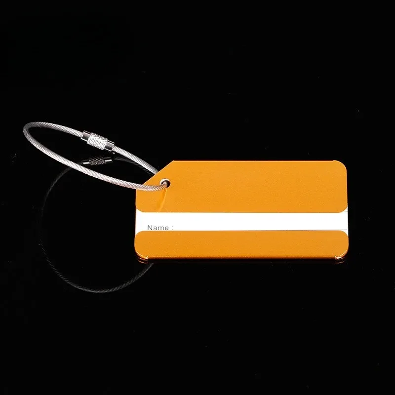 étiquette bagage métallique orange blanche bande horizontale géométrique identification voyage accessoires voyage porte adresses