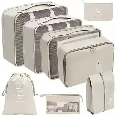 organisateur voyage polyester beige clair sac rangement vêtements chaussures sous-vêtements pochettes transparentes cubes modularité transport