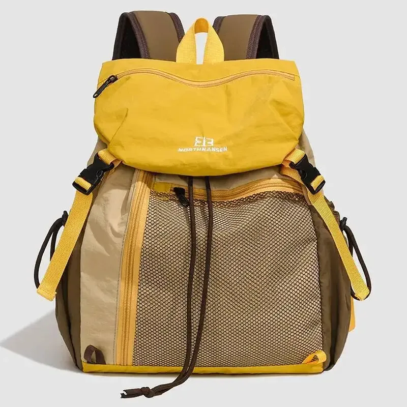 sac dos nylon noir poche zip latérale maille grise bretelles bandes logo blanc style voyage capacité litres