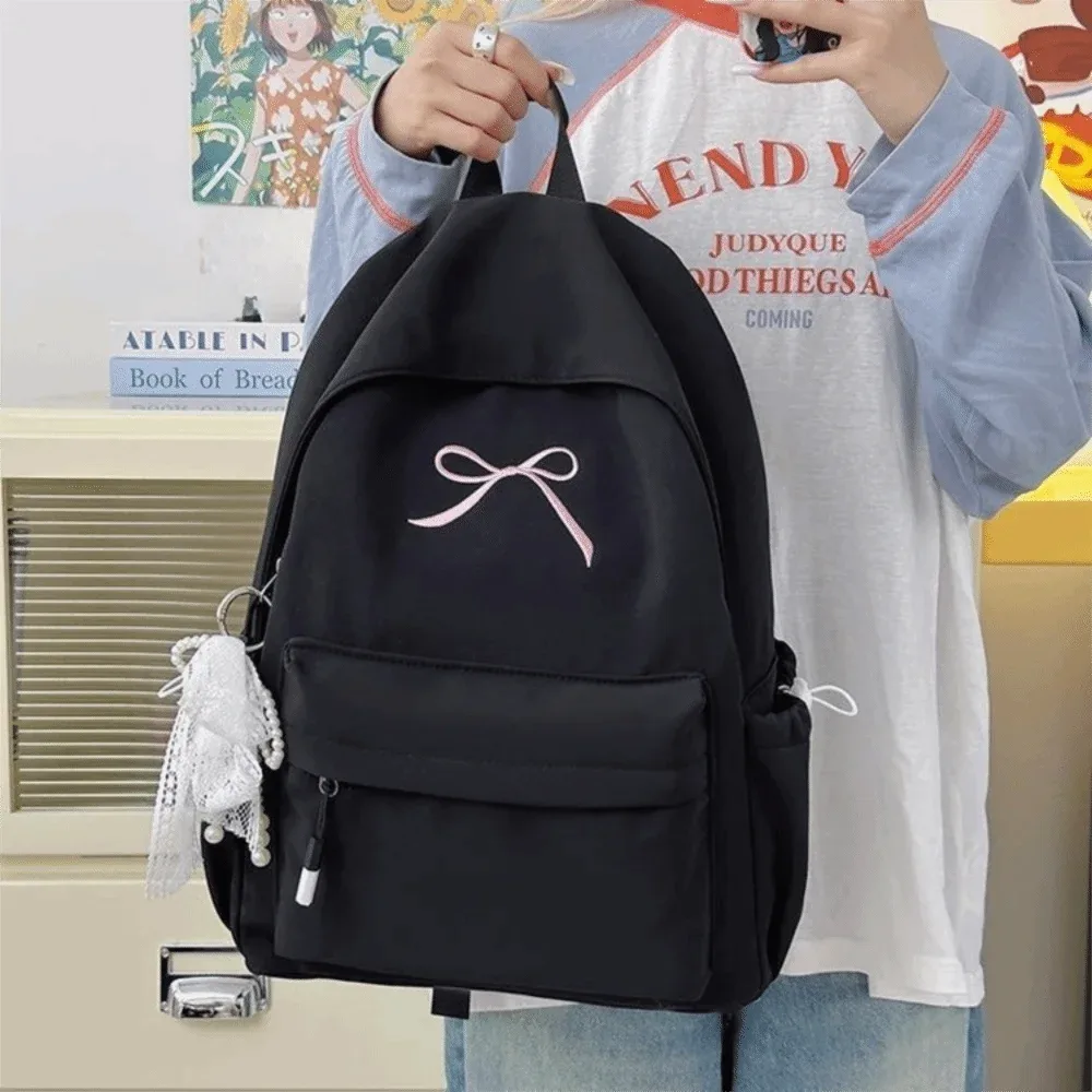 sac à dos portable avec nœud brodé pour filles, cartable en nylon de grande capacité pour étudiants, sac à dos de voyage léger de couleur unie