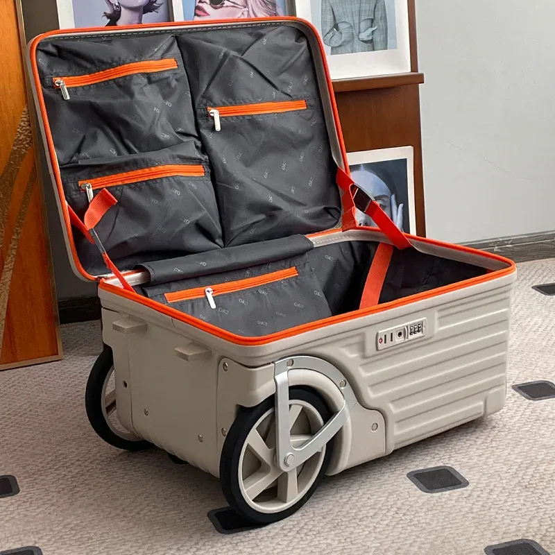 valise roulettes toupie abs gris clair orange poignées sécurité motif intérieur cercles noirs gris durabilité transport