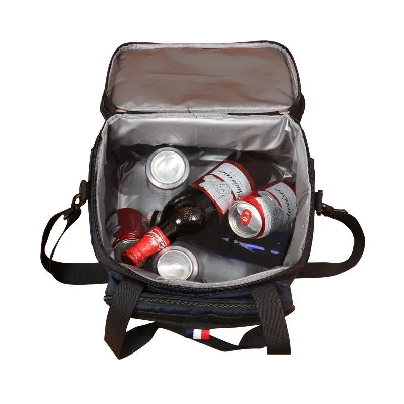 sac dos isolement polyester bleu bandes noires blanches poignées sangle latérale compartiment intérieur gris conserver aliments frais voyage