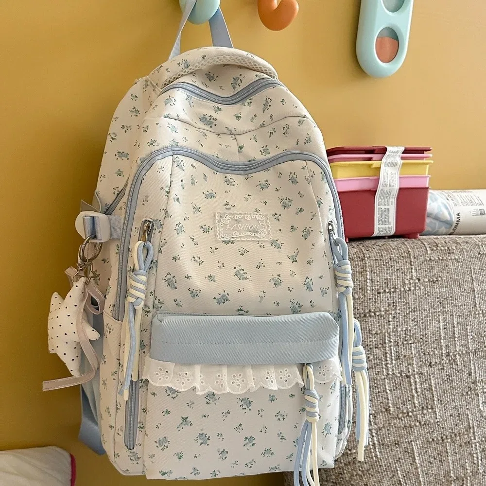 sac à dos à imprimé floral avec décor en dentelle, ultra léger, avec pendentif étoile, esthétique fraîche, grande capacité, idéal pour les trajets quotidiens.