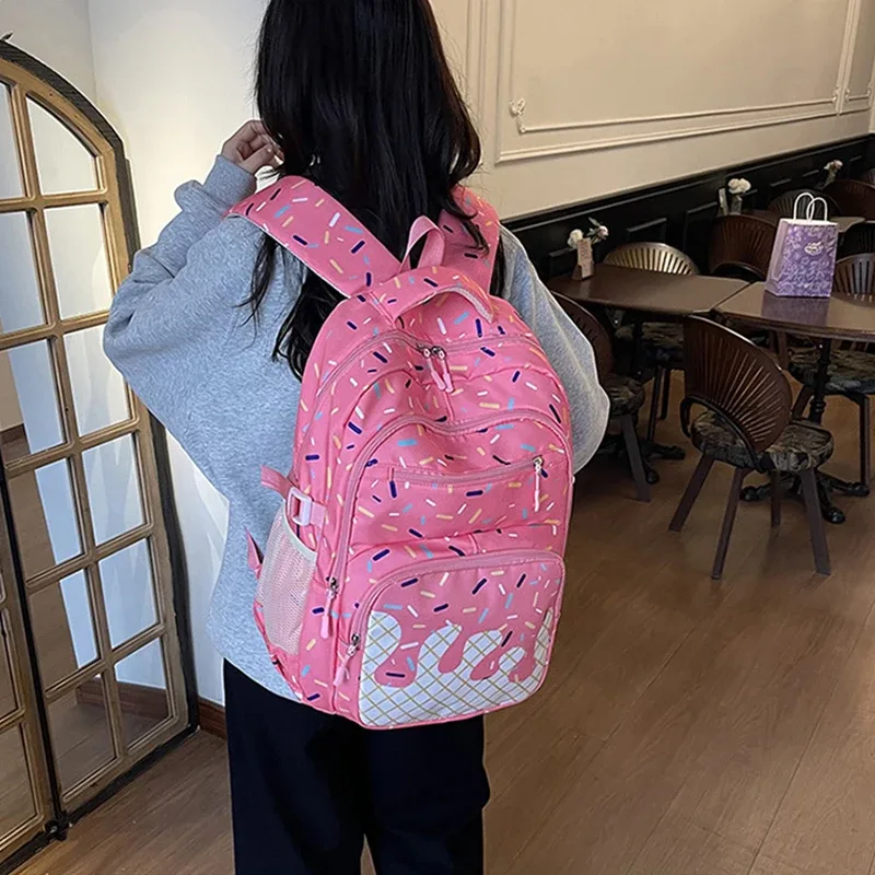 sac dos polyester motifs glace fond rose bleu violet conception uniforme poches lateral fermeture glissière imperméable poche integree femme voyage