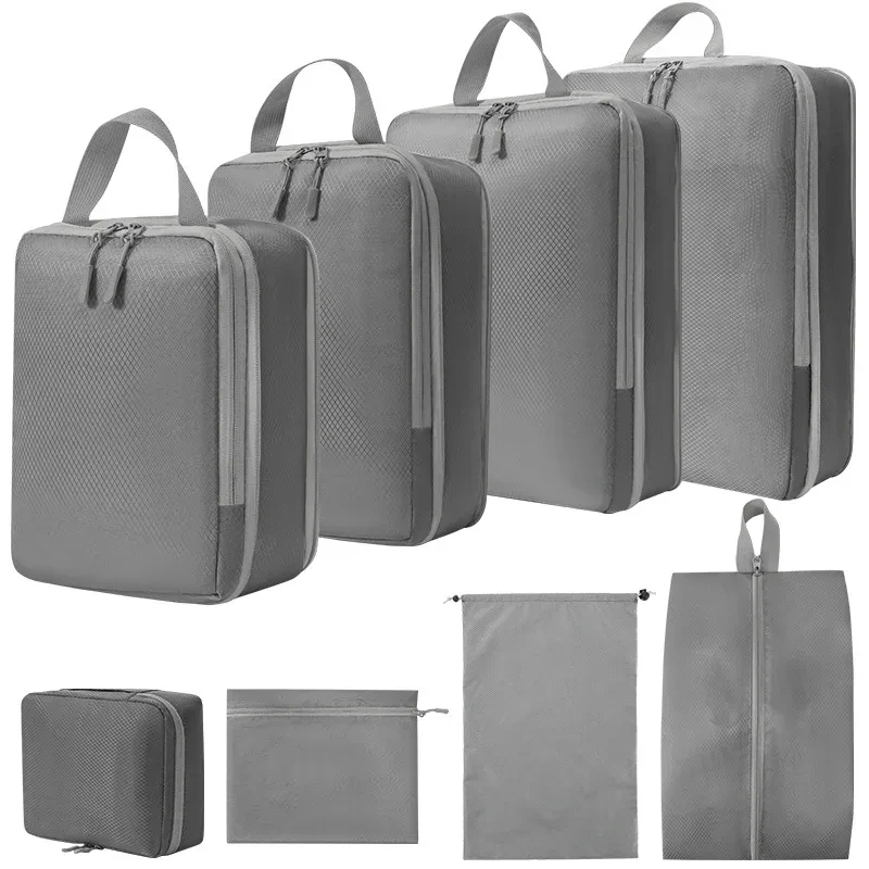 organisateur voyage polyester gris clair poignée noire fermeture glissière compressible sac chaussures rangement cube traçabilité usage polyvalent