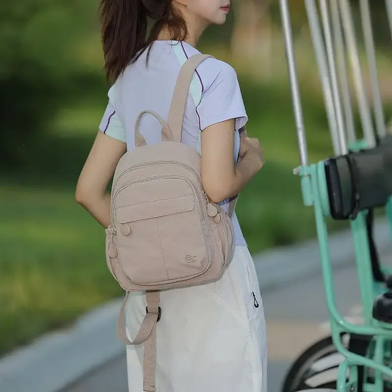 Nouveau sac à dos léger et compact, minimaliste et tendance, résistant à l'eau, polyvalent pour les voyages, le sport, l'école et l'usage quotidien