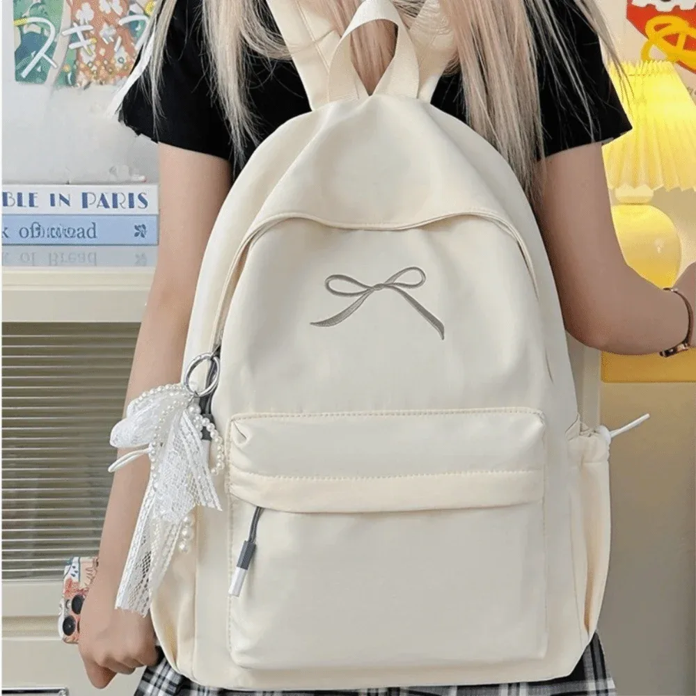 sac à dos pour filles avec nœud brodé, en nylon, grande capacité, léger, couleur unie, pour étudiants, sac d'école, sac de voyage