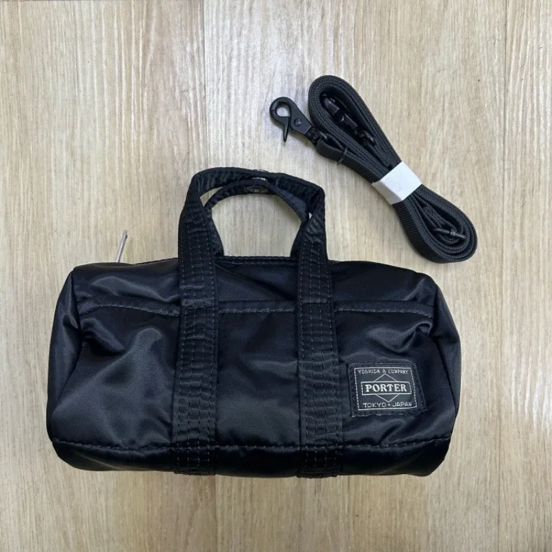 sac à main porter howl mini 2way pour hommes et femmes, petit sac bandoulière léger, style streetwear, mode quotidienne, portable pour les trajets quotidiens et les voyages.