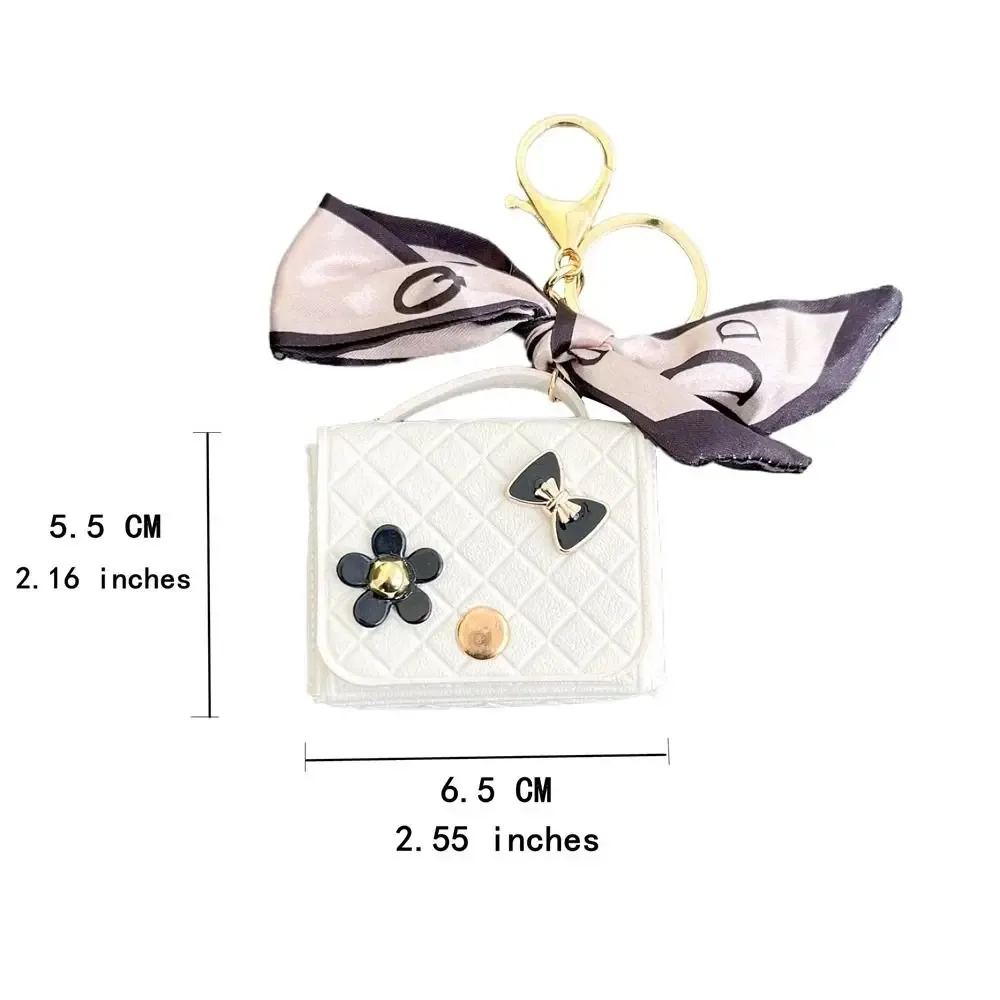 nouvelle pochette de rangement en cuir 2026 pour écouteurs, mini porte-clés créatif, pendentif couleur unie, étui pour écouteurs bluetooth