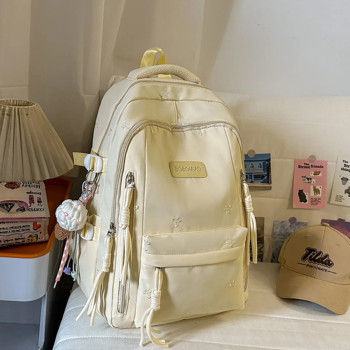 sac à dos traveasy 2026 nouveau motif nœud mignon polyvalent en nylon avec pendentif pompon protection dorsale pour étudiants