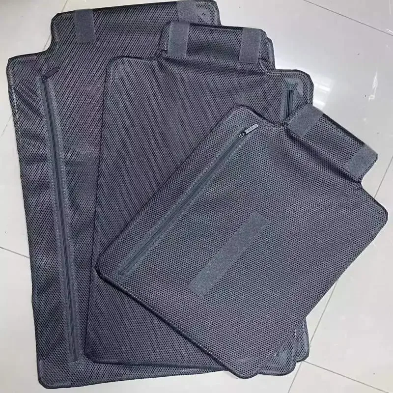 organisateur voyage tissu gris rugueux fermeture glissière poignée latérale adaptation tailles valises usage pratique