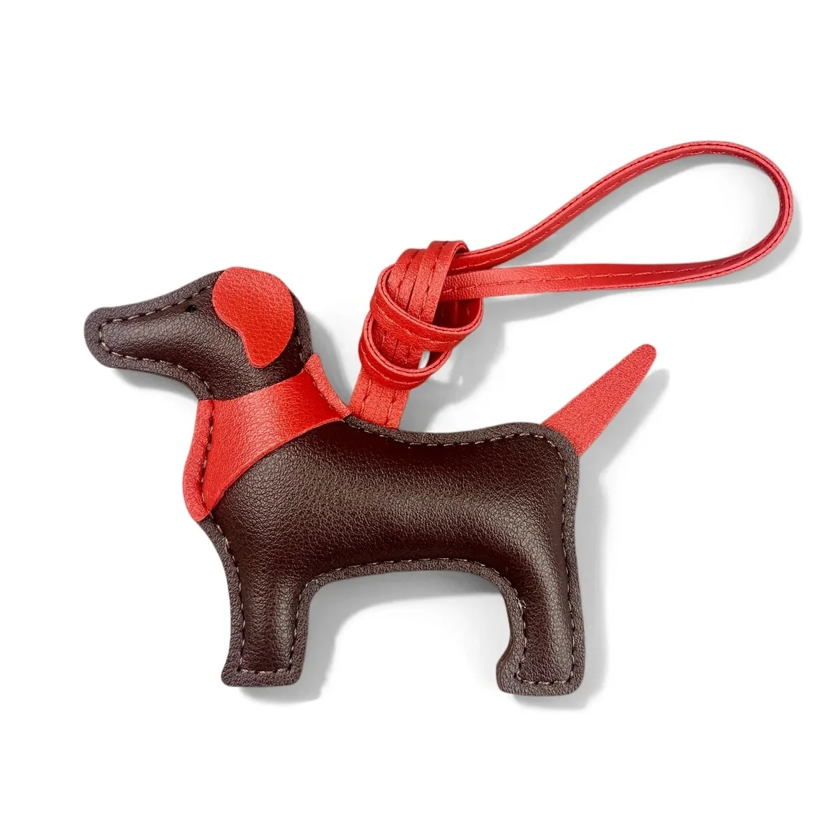 sac dos cuir motif chien silhouette orelles criniere couleurs contrastantes ornements voyage usage journee accessoires sac main porte clefs