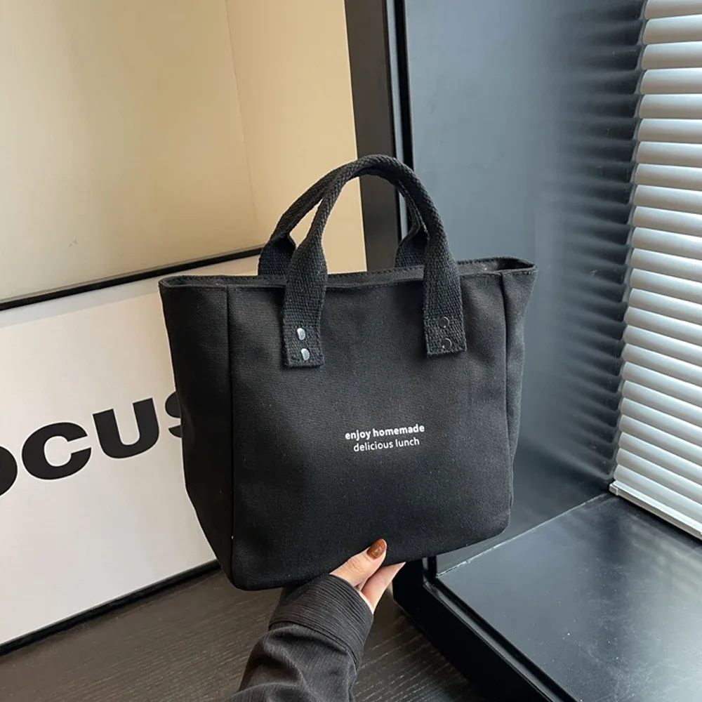 sac fourre-tout décontracté en toile avec pendentif cloche et fermeture éclair ; ce sac fourre-tout élégant et durable est parfait pour l'école et le travail
