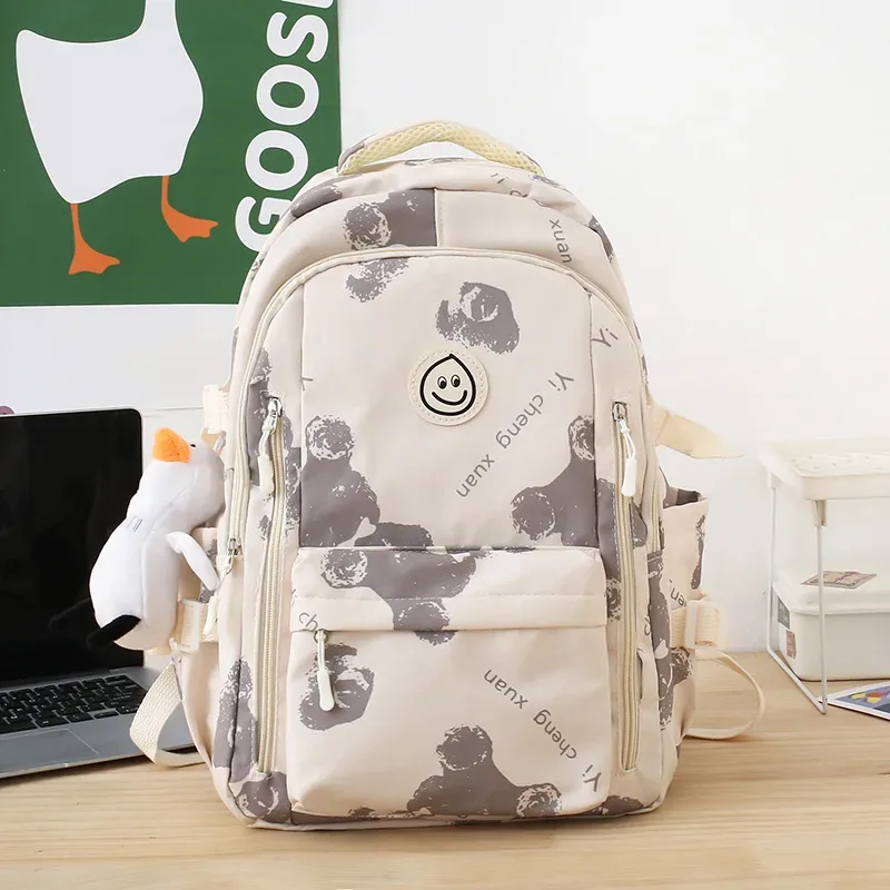 sac dos nylon blanc rouge bleu patchwork bandoulière arquée poche ouverte informatique classement souple voyager école collège