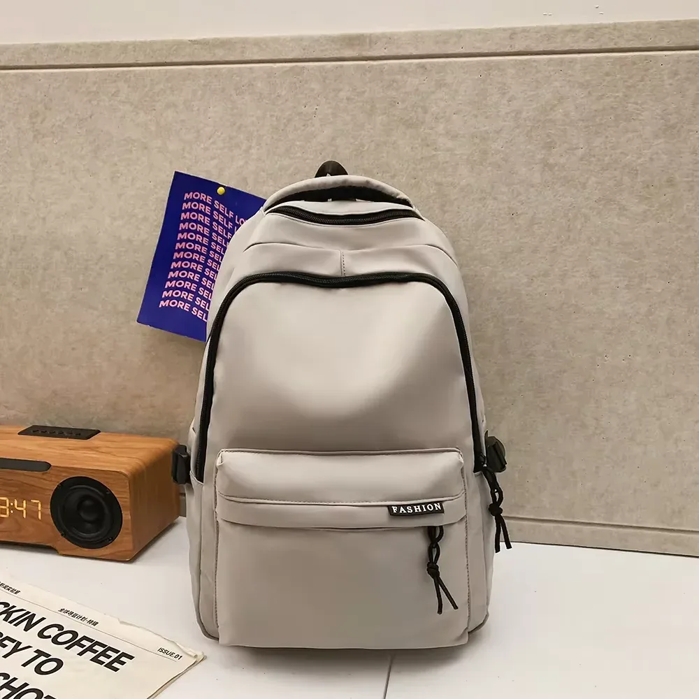 sac à dos de grande capacité de couleur unie, sac noir simple pour étudiants et voyages