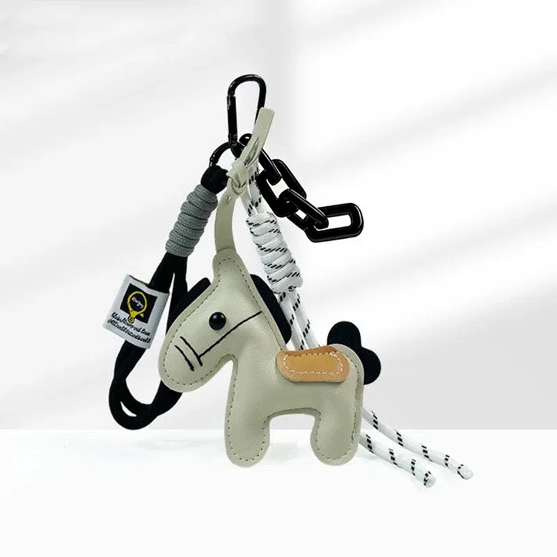 porte-clés en corde tressée avec pendentif en cuir motif cheval, accessoire de mode pour sacs à main, sacs à dos et décoration de clés de voiture