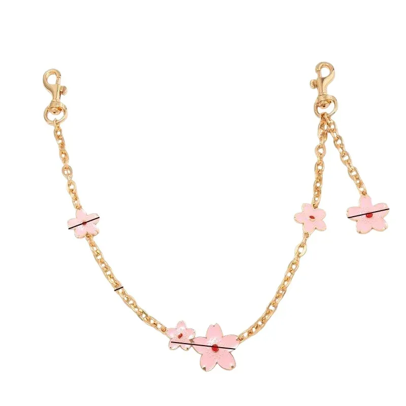 bracelet extensible zinc motif fleur coeur décoration sac femmes chaîne ornementation multifonction usage jour personnalisation style chic mode transport