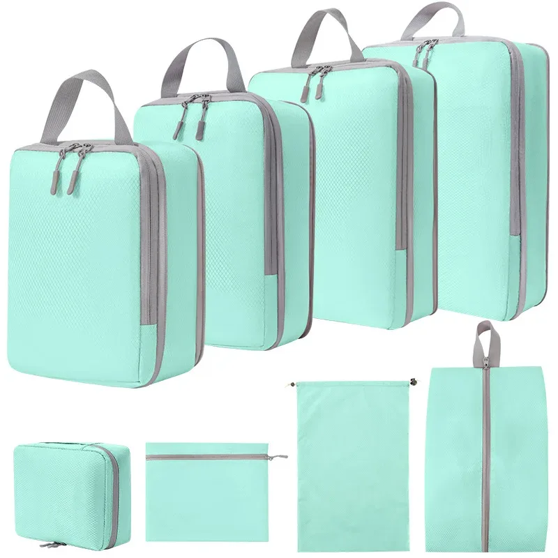 organisateur voyage polyester gris clair poignée noire fermeture glissière compressible sac chaussures rangement cube traçabilité usage polyvalent