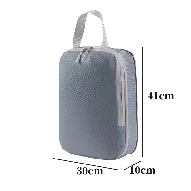 organisateur voyage polyester blanc bandes grises format rectangulaire poignées grises compression vêtements articles toilette rangement valise