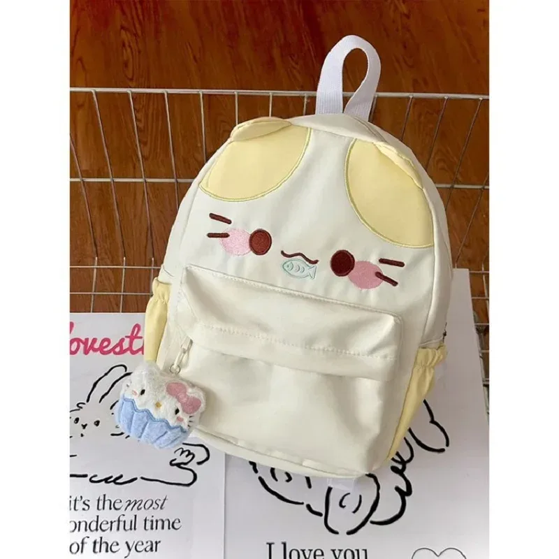 sac à dos imperméable en nylon pour femme avec motif chat dessinant une fille mangeant du poisson, sac d'école pour filles avec détails brodés, sac à livres