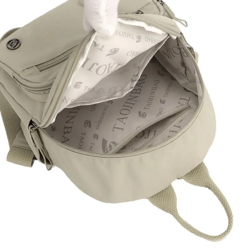 sac à dos portable en nylon pour femme, couleur unie, léger, multi-poches, décontracté, tendance, imperméable, nouveau cadeau 2026