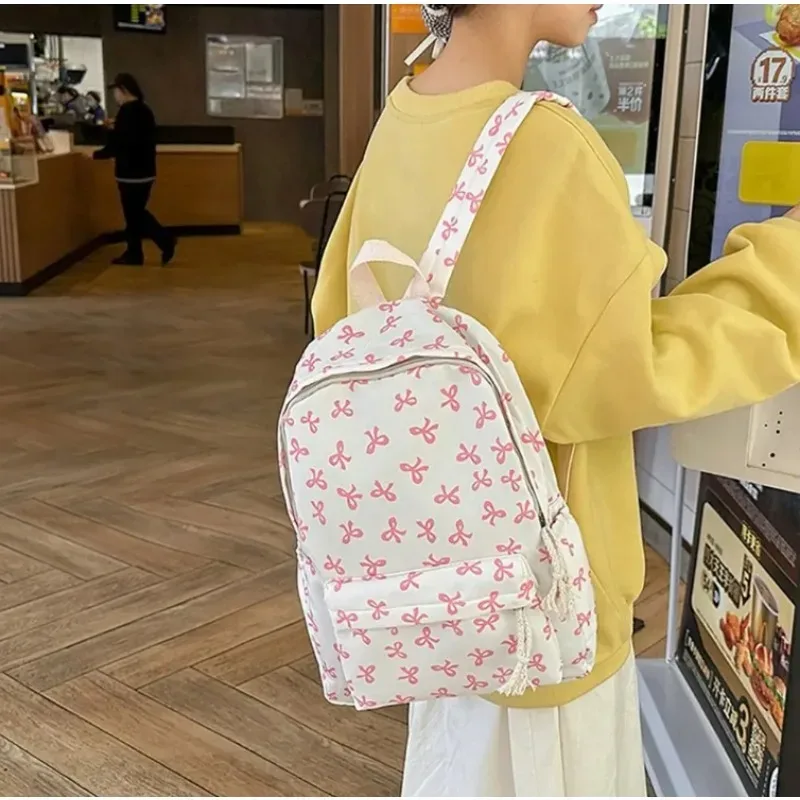 sac à dos tendance et mignon à imprimé nœud pour femme, compartiment pour ordinateur portable avec bretelles réglables, sac idéal pour la rentrée scolaire et les voyages sur le campus