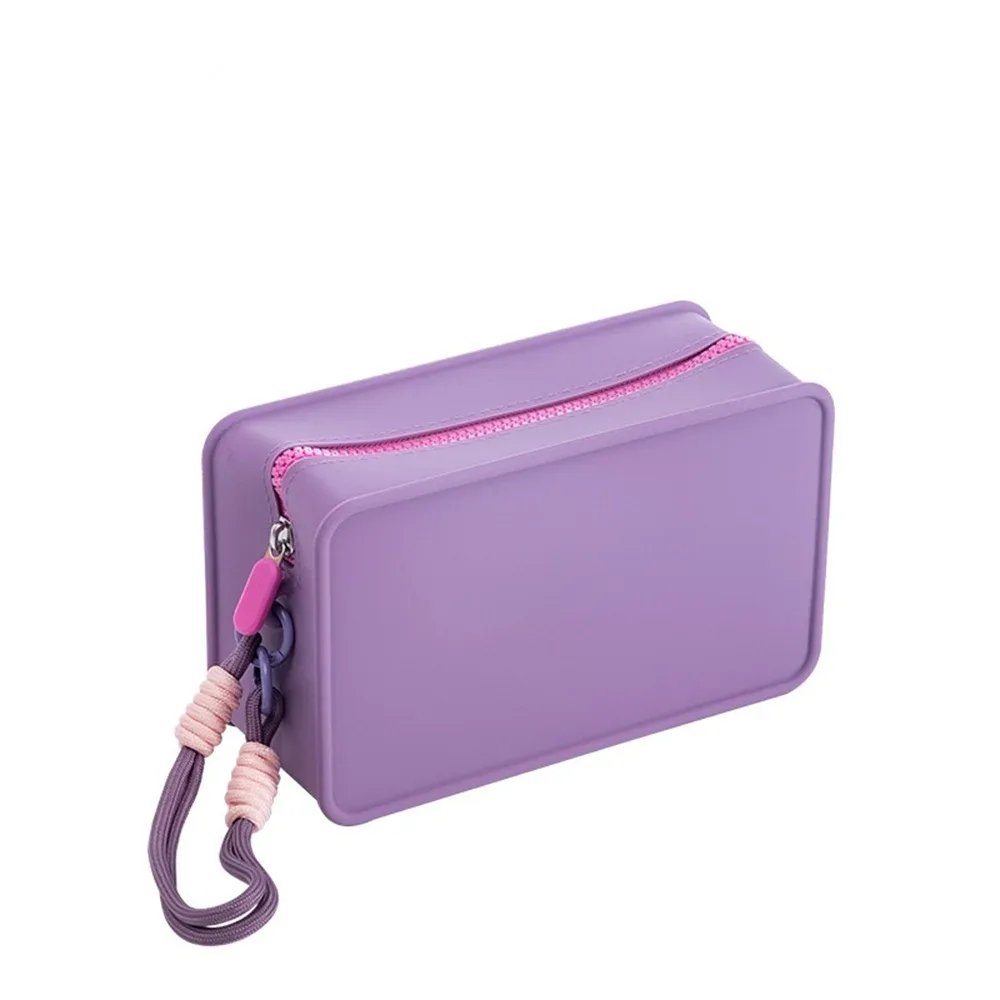 sac de maquillage en silicone couleur bonbon, avec corde de poignet tressée, sacs à cosmétiques portables avec lanière, sac de toilette étanche à fermeture éclair pour rouge à lèvres