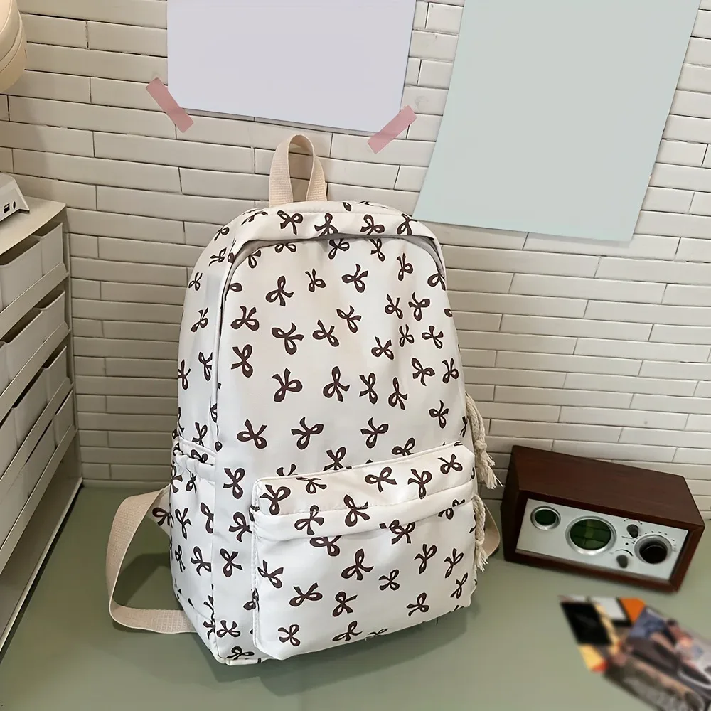 sac à dos tendance et mignon à imprimé nœud pour femme, compartiment pour ordinateur portable avec bretelles réglables, sac idéal pour la rentrée scolaire et les voyages sur le campus