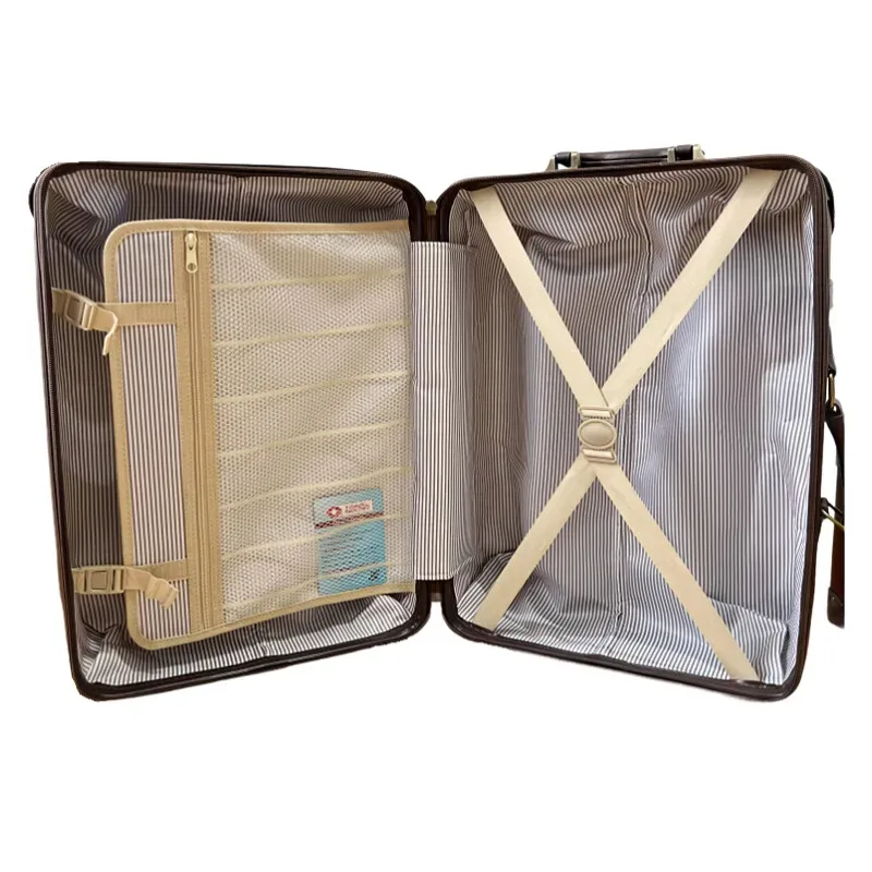 valise voyage forme carrée poignées latérales marron bandes noires rivets dorés cuir simili matière bagage roulante